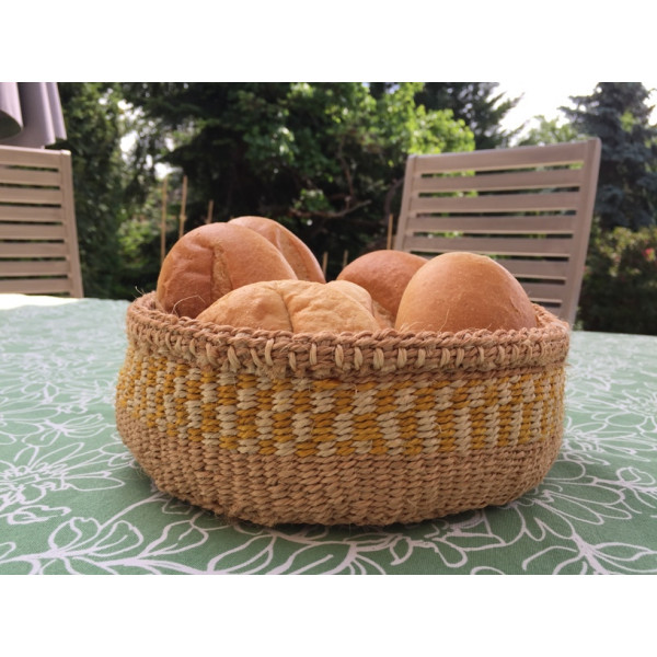Wicker bread basket made of natural material with yellow-natural pattern